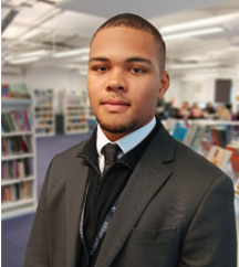 A person in a suit and tie

AI-generated content may be incorrect.
